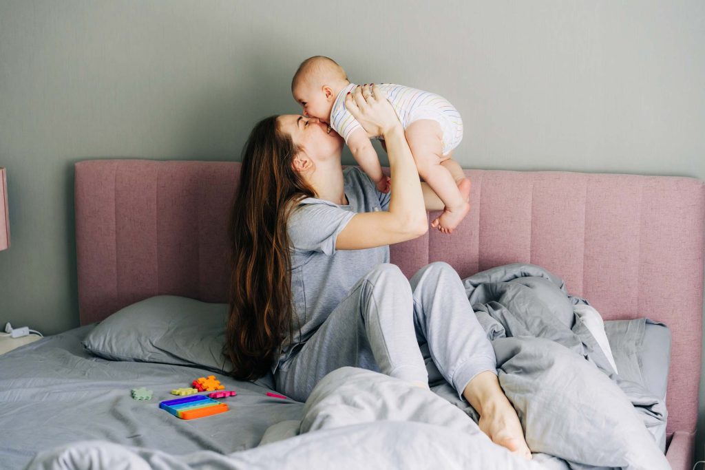 A mother holding her newborn baby